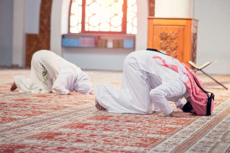 African Muslim Couple Praying inside of beutiful mosqueの写真素材