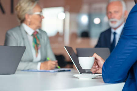 Group of business persons in discussion. Working together.の写真素材