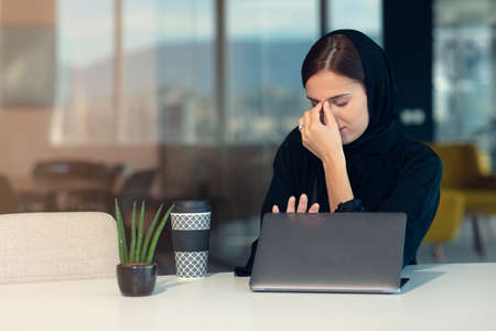 professional young female muslim worker having problemの写真素材