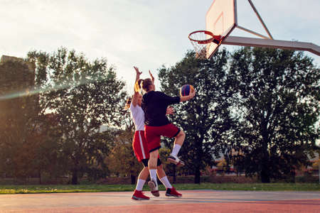 woman basketball player have treining and exercise at basketball court at city on streetの写真素材