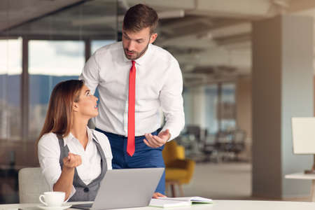Happy Business people working together on computerの写真素材