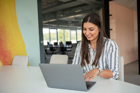 Hipster Girl use Laptop huge Loft Studio.Student Researching Process Work.Young Business Woman Working Creative Startup modern Office.の写真素材