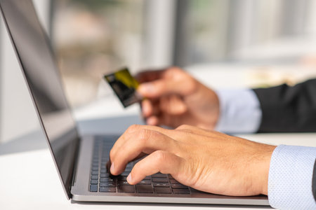 Woman working at home office hand on keyboard close upの写真素材