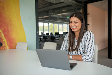 Hipster Girl use Laptop huge Loft Studio.Student Researching Process Work.Young Business Woman Working Creative Startup modern Office.の写真素材
