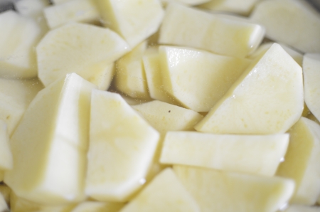 Cut Potatoes In a Pot of Water の写真素材