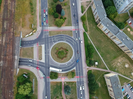 Roundabout intersection in three directions with island, aerial viewの写真素材