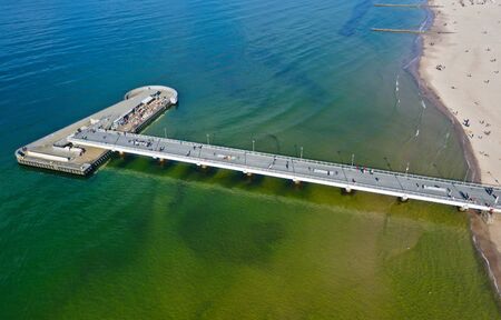 KOLOBRZEG, POLAND - 25 APRIL 2019 - Aerial view on Kolobrzeg city, area of Molo pier at Baltic Sea shore with Cafe Restaurantのeditorial素材