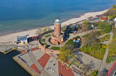 KOLOBRZEG, POLAND - 25 APRIL 2019 - Aerial view on Kolobrzeg city, area of Lighthouse at Baltic Sea shore and Ship Portのeditorial素材