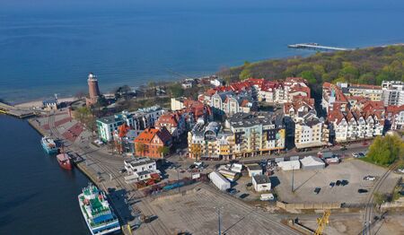 KOLOBRZEG, POLAND - 25 APRIL 2019 - Aerial view on Kolobrzeg city, area of Lighthouse at Baltic Sea...