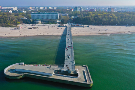 Aerial view on Kolobrzeg city, area of pier and beach at baltic sea shore.の写真素材