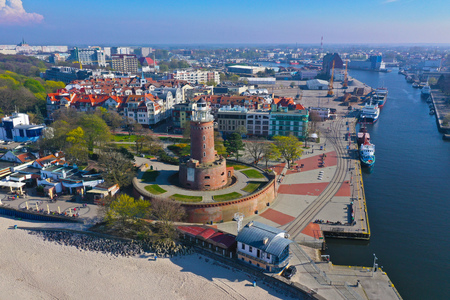 Aerial view on Kolobrzeg city, area of Lighthouse at baltic sea shore and ship portの写真素材