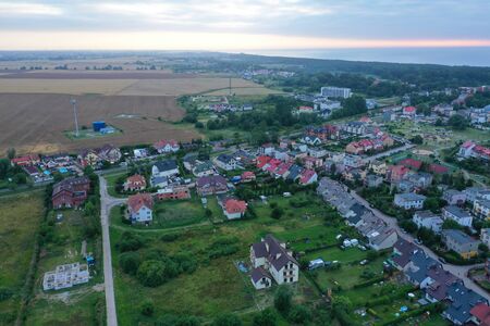 Drone aerial perspective view on colorful housing estate in touristic Mielno city at Baltic Sea.の写真素材