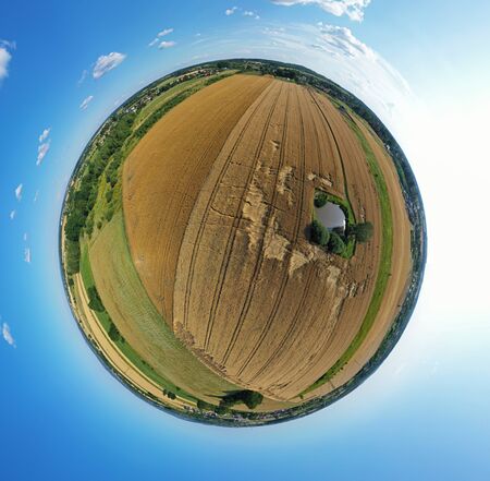 Aerial drone 360 degree panoramic view on agricultural landscape with wheat field, green water pond,...