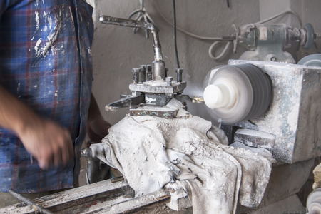The cutting process in a stone-cutting factoryの写真素材
