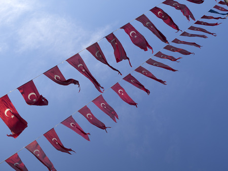 Banner of the Turkish Flags hanging in the a street in Istanbul, Turkey.の写真素材