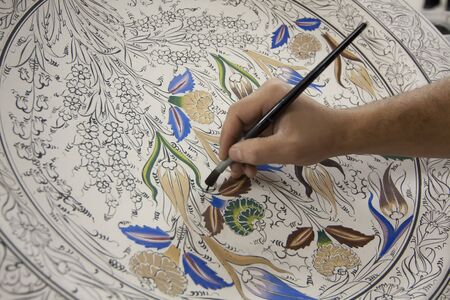 Painting of porcelain by hand. A traditional iznik  Nicea pattern.の写真素材