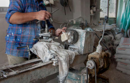 Cappadocia, TURKEY - October 31, 2009: The master makes a souvenir from onyx on the machine. Manual labor.Cappadocia, Turkeyのeditorial素材