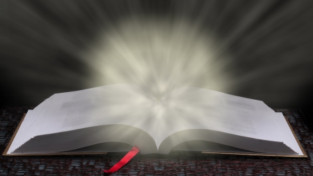 Wisdom and education concept with bright light glowing from book to signify learningの写真素材