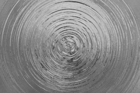 A silver metallic illustration with an abstract circular perspective の写真素材