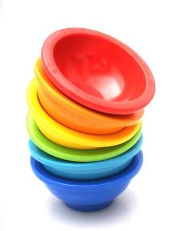 Stack of rainbow mixing bowls used in the kitchenの写真素材