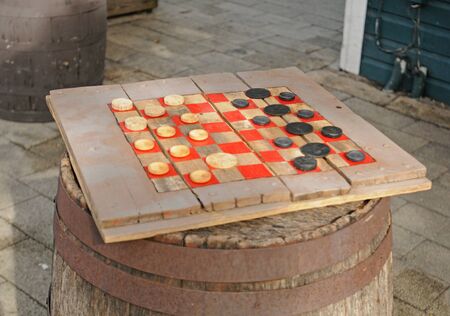 rustic checkers game on a barrelの写真素材