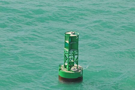 nautical buoy in ocean 