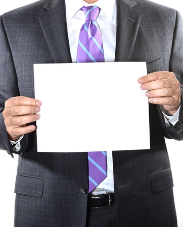 Businessman with purple tie holding a blank sheet of paperの写真素材