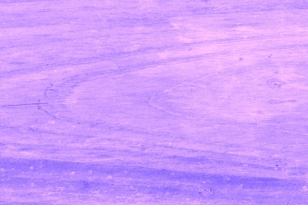 a purple and pink wooden background that looks weatheredの写真素材