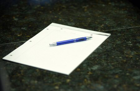notebook on granite table in an office for businessの写真素材
