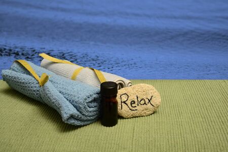relax with wellness spa products and ocean for aromatherapy meditationの写真素材