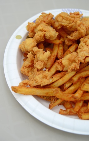 gator bites and french fries on a plate