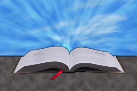 Concept of Sun rays shining down from heaven on a Christian bibleの写真素材