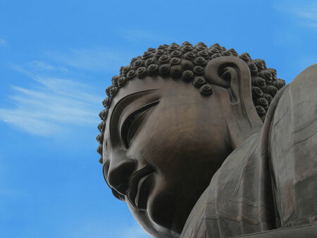 buddha symbol against blue sky backgroundの写真素材