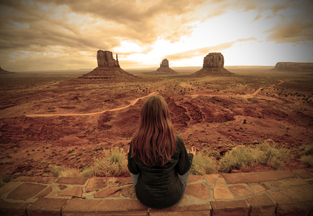 Meditation in the desert in Monument Valley with a rustic feelの写真素材