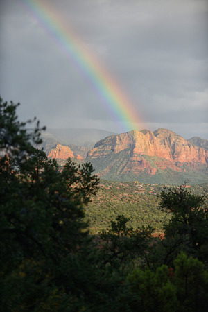 Stormy clouds and rainbow over Sedona, Arizona in Southwestern United Statesの写真素材