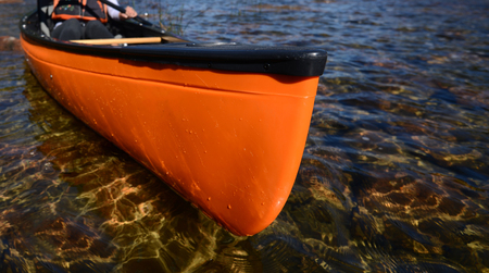 bright orange kayak in the water