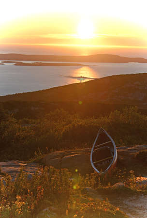 Outdoor scenery in Maine with a kayak on a rock near the oceanの写真素材