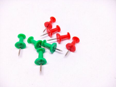 colorful push pins on white background