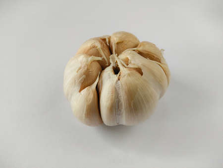 Closeup garlic (Allium sativum) on a white background. garlic as a seasoning for flavoring foodの写真素材
