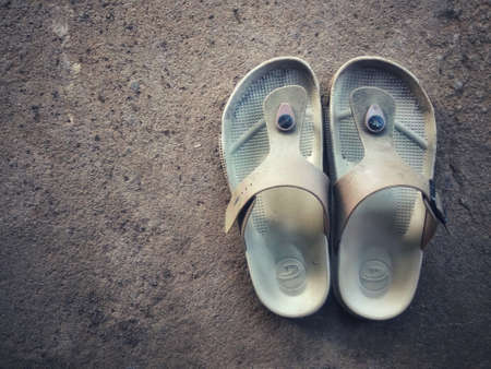 A pair of sandals on beach with copy space.sandals is footwearの写真素材