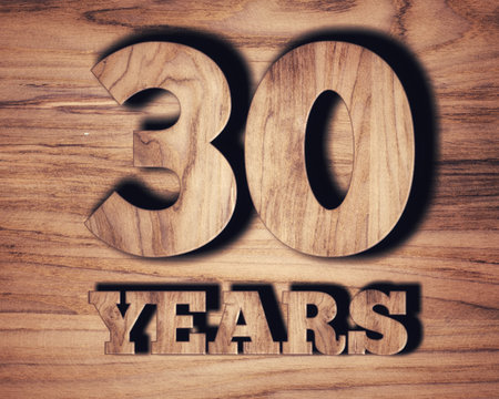 30 years old text on wooden wall. 30 years old concept.の写真素材