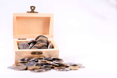 Malaysia Ringgit coins in a small wooden box selective focus and shallow depth of field,The concept of financial planning, savings, Busines successfulの写真素材