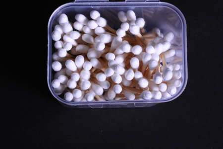 Cutton bud or cotton swab shot on a black background.の写真素材