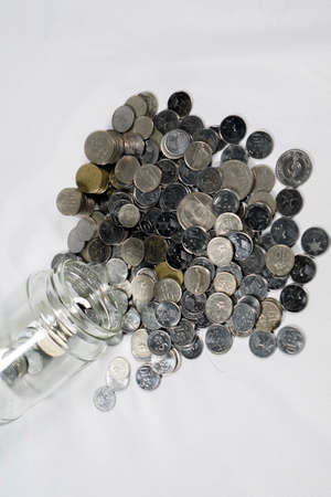 Financial concept, A malaysia ringgit coin in transparent glass bottle isolated white backgroundの写真素材