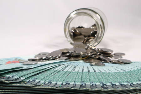 Financial concept, A malaysia ringgit coin in transparent glass bottle isolated white backgroundの写真素材