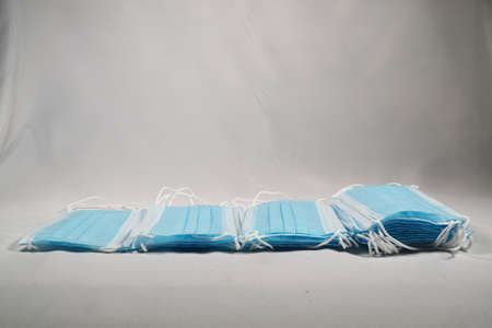 Surgical mask with rubber ear straps. Typical 3-ply surgical mask to cover the mouth and nose....