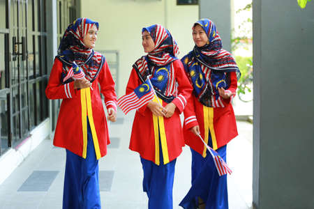 Kuala Lumpur, Malaysia : Circa July 2019 - Malaysian college students with Malaysian Flag during the celebration of Hari Kemerdekaan, the Independence Day of Malaysia.のeditorial素材