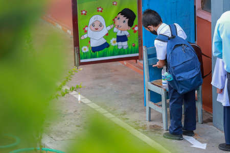 Kedah/Malaysia-September 9 2020 : Malaysian kids attending school in Alor Setar Kedah Malaysia. Kids aged between 7 to 18 years old are compulsory to attend school in Malaysia.のeditorial素材