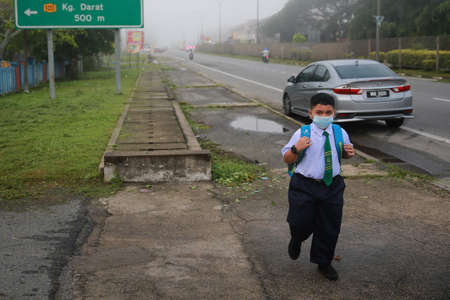 Kedah/Malaysia-July 22 2020: Students wearing face masks on the first day of school reopening at a Primary School in Changlun Kedahのeditorial素材