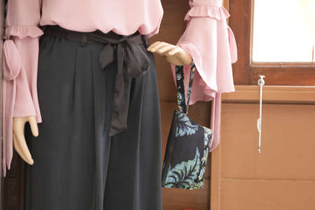 Female mannequins wearing modern batik muslim dresses and hijabs exhibited in batik workshopの写真素材